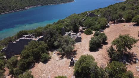 approaching aerial drone view over ancient lycian ruins on the mediterranean coast of turkey