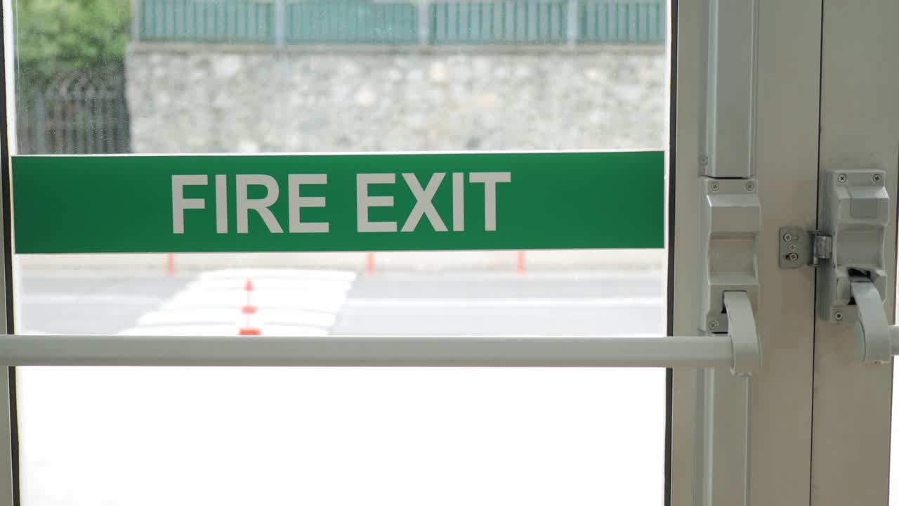 A Green Fire Exit Sign on a Door