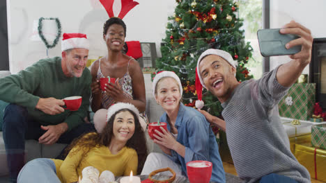 happy group of diverse friends spending time at christmas party