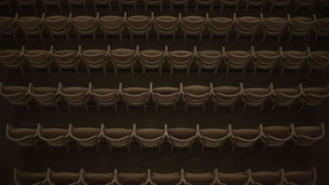top shot of empty concert hall chairs in retro colors