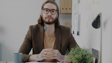 businessman in office during video call