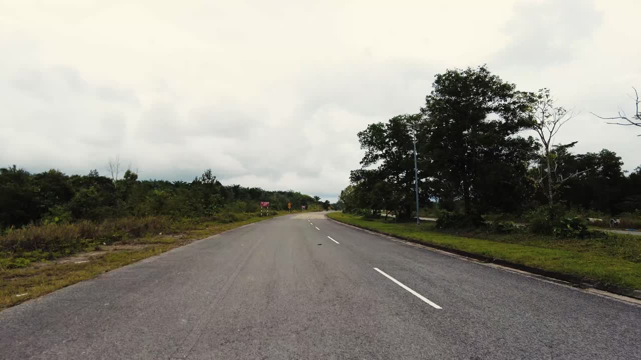 Beautiful View Drive Along Sempadi Lundu Coastal Road with Green Forest and Mountain,Sarawak,Borneo.