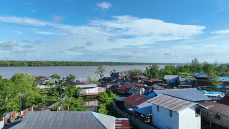 wide river beautiful blue sky with drone passing over the agats mosque in papua indonesia