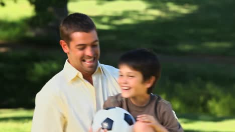 father carrying his son and enjoying the time together