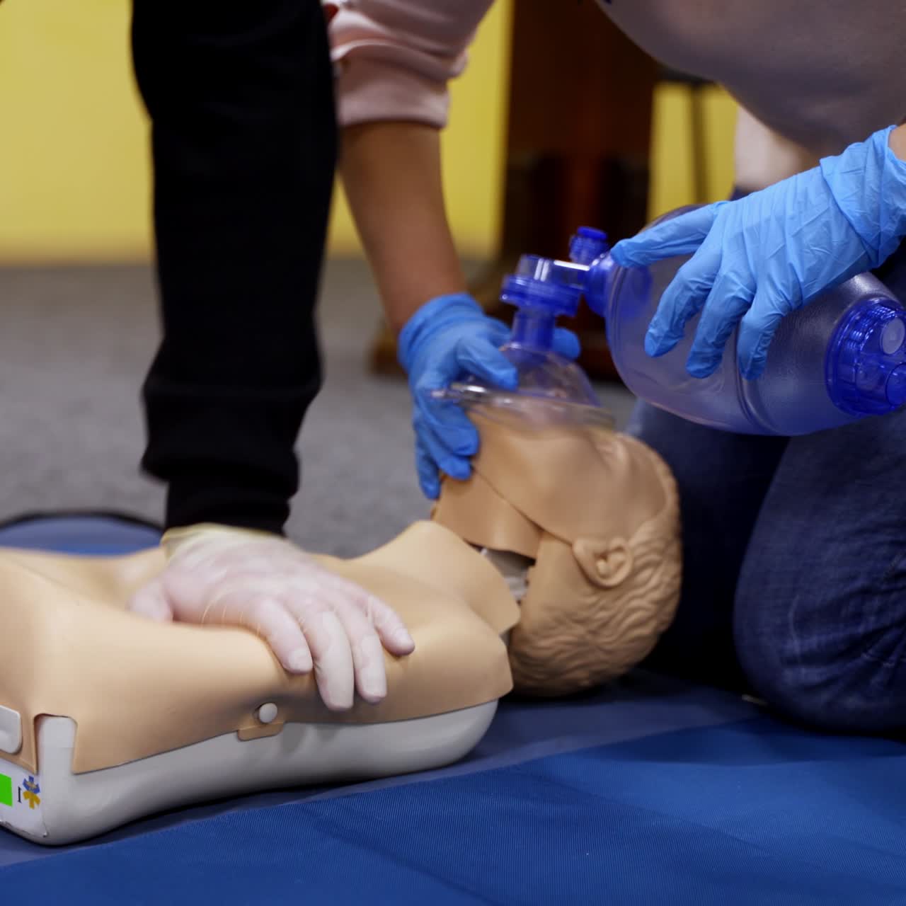 Training practice on a dummy. Students study doing resuscitation technique on a mannequin to save life. Cardiopulmonary resuscitation