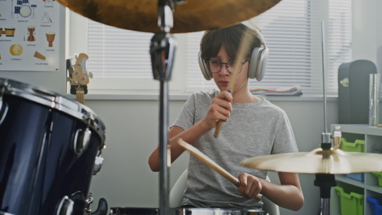 Teenage Drummer Practicing at Home