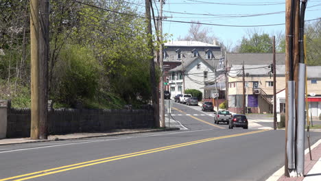 a street in a small american town with light traffic