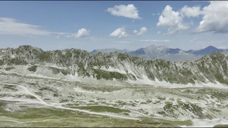 Aerial-forward-shot-drone-shot-of-mountains-in-French-Alps,-Les-Arcs,-France-during-summer