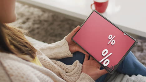 caucasian woman using tablet for online shopping, slow motion