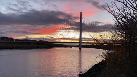 the northern spire bridge over the river wear during a beautiful orange sunset