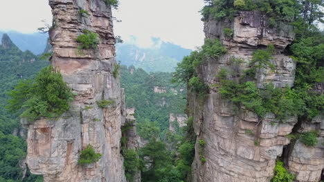 proximity flight between two vertical rock spires in hunan, china