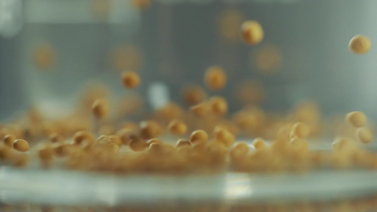 macro shot of seeds falling into your glass jar.