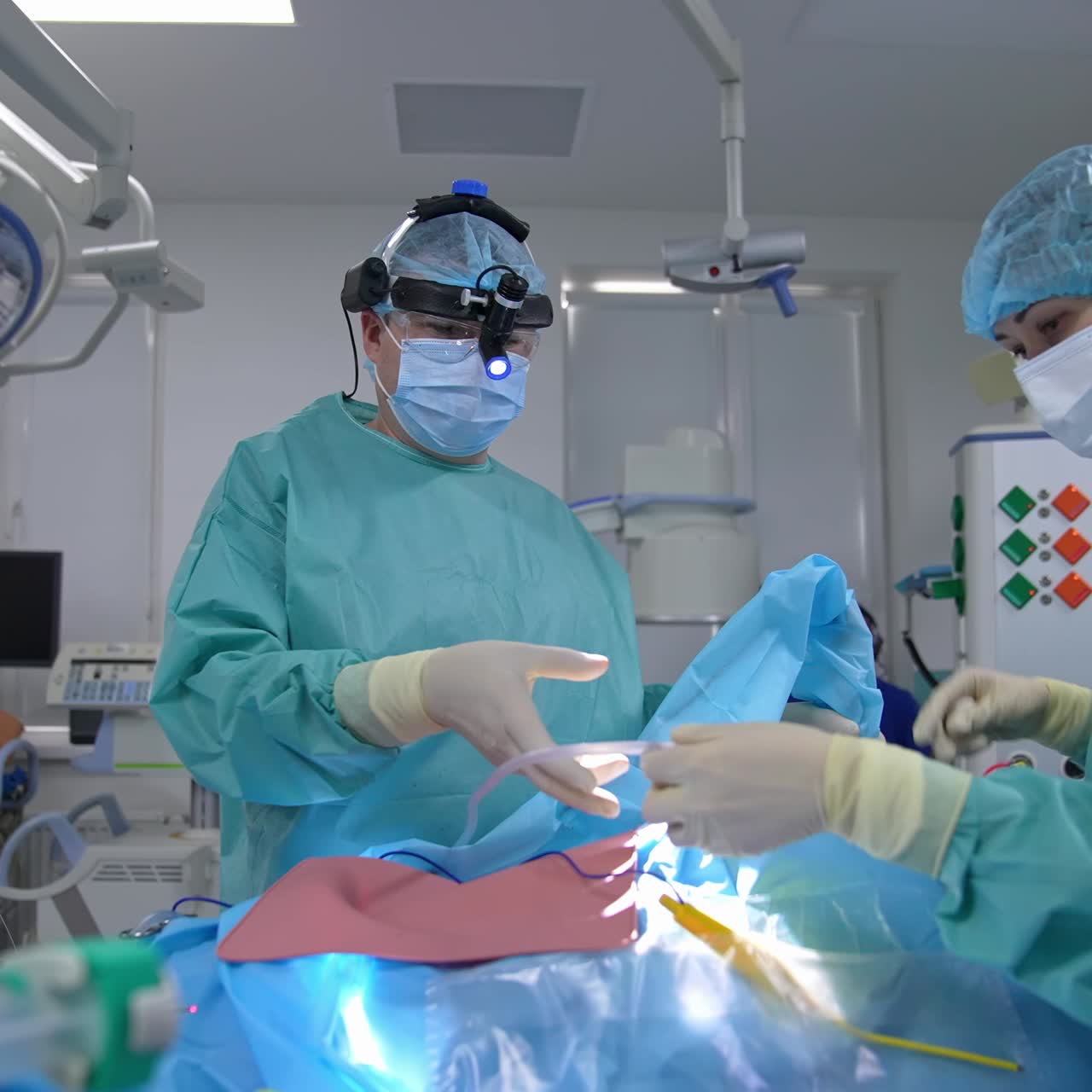 Team surgeon at work in operating room.. Team of professional multi-race doctors operating surgery in hospital room