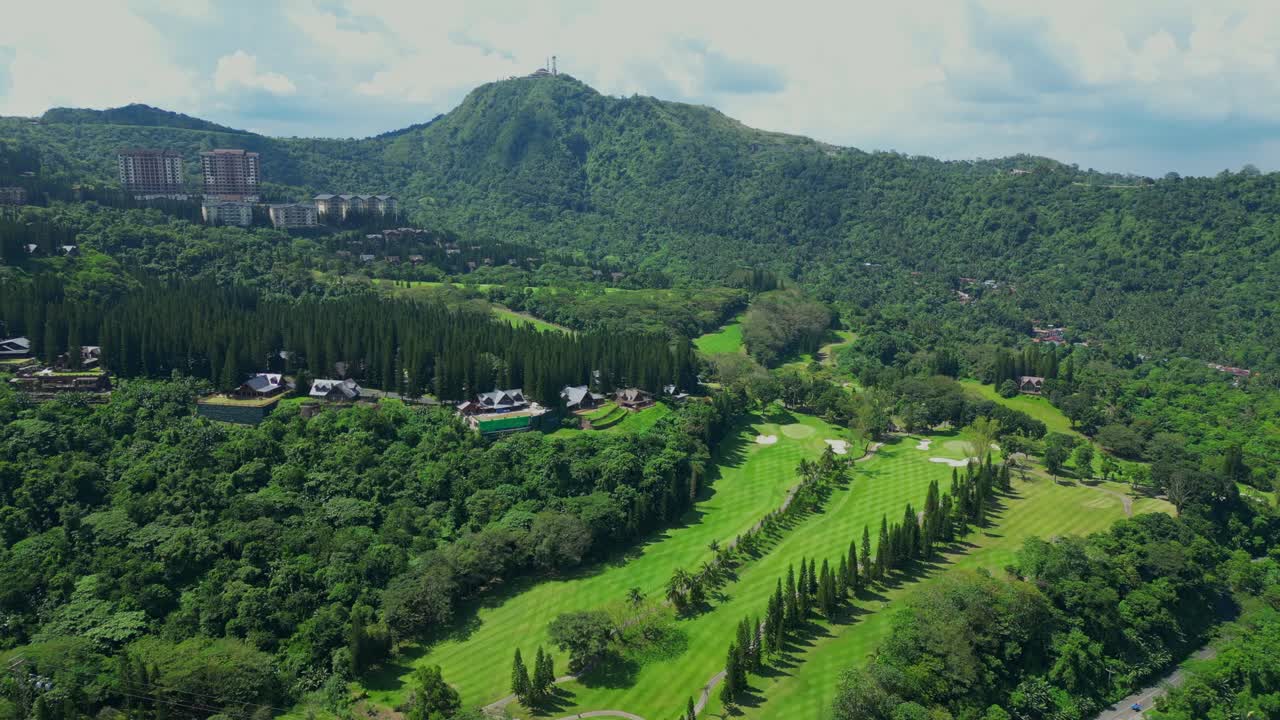 An aerial view of dense forested hills with pine trees and scattered pinecones in Tagaytay Highlands, Batangas, Philippines