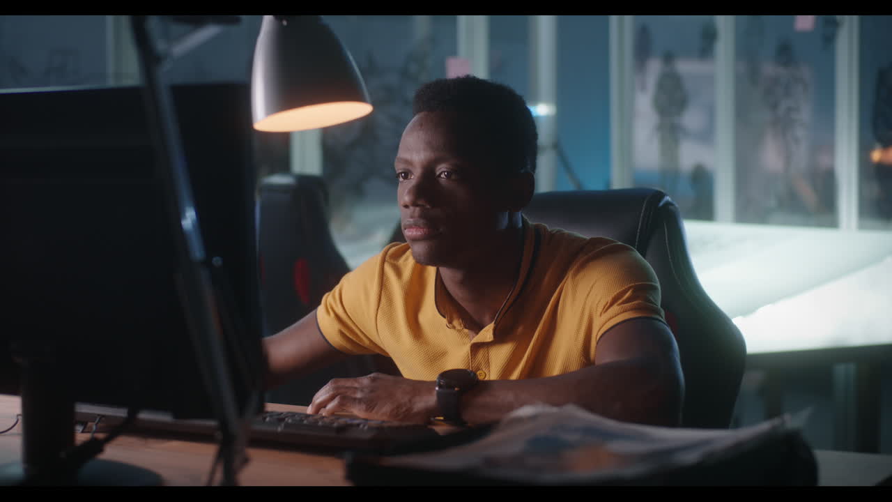 Man working on computer at night