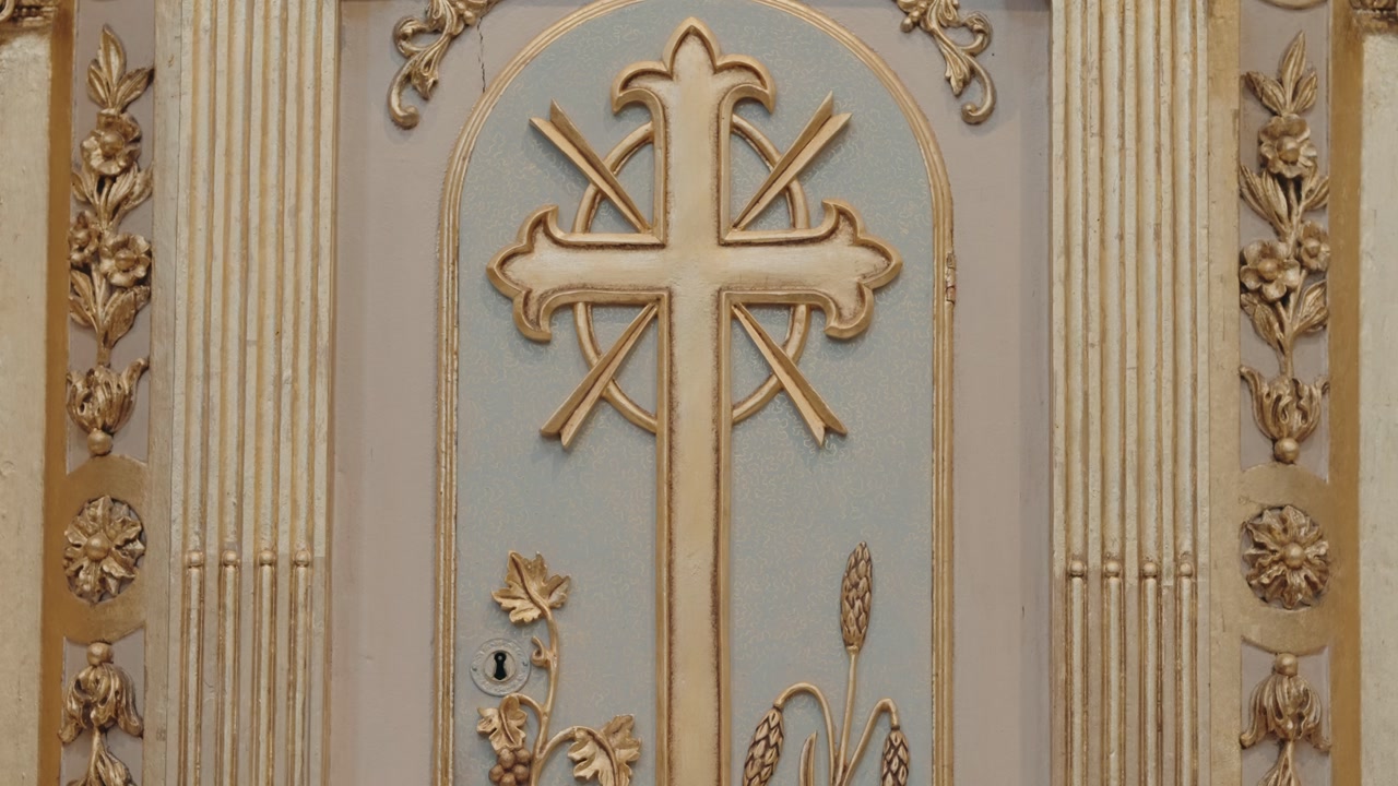 ornate sacrario tabernacle with golden cross wheat and grapes