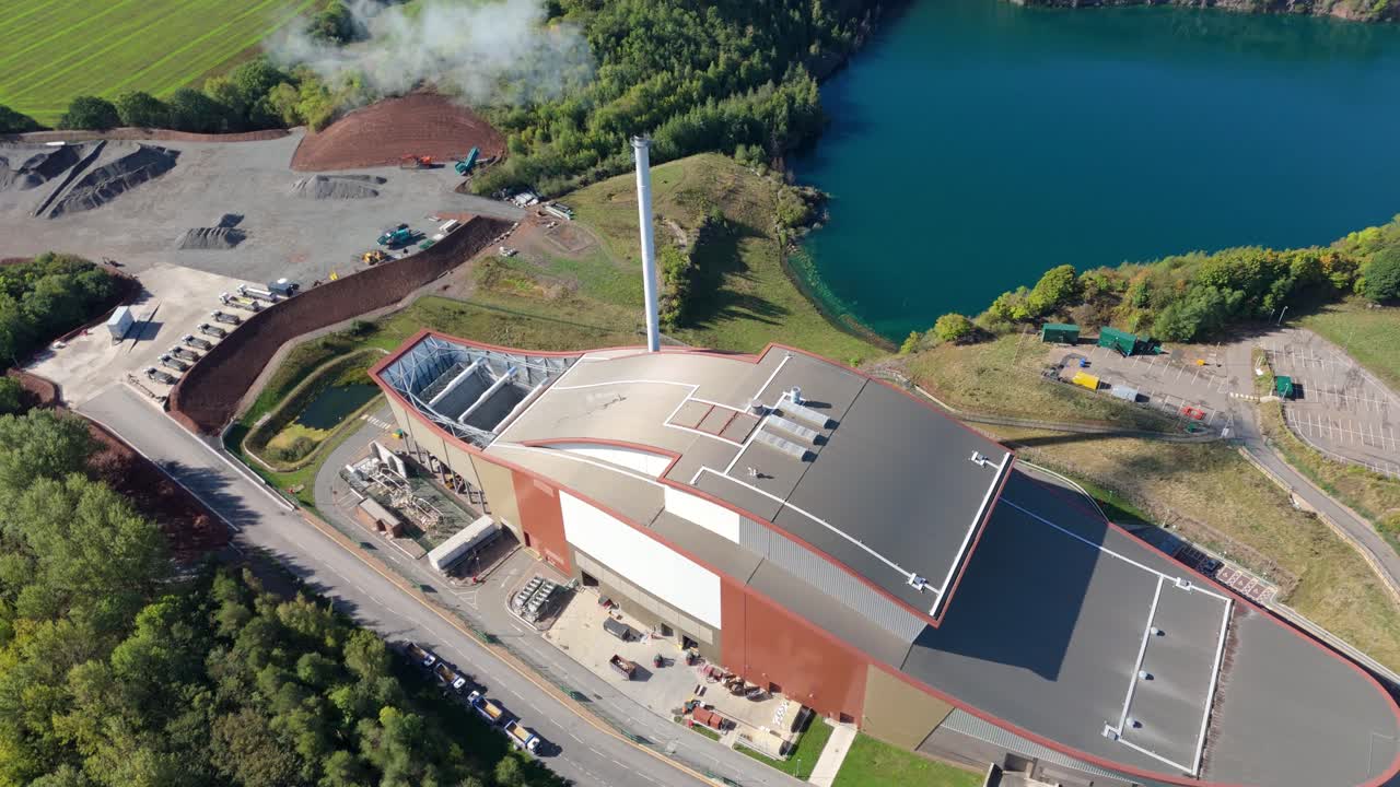 Bio incinerator power station with chimney and pellet burning captured by drone near Loughborough, UK