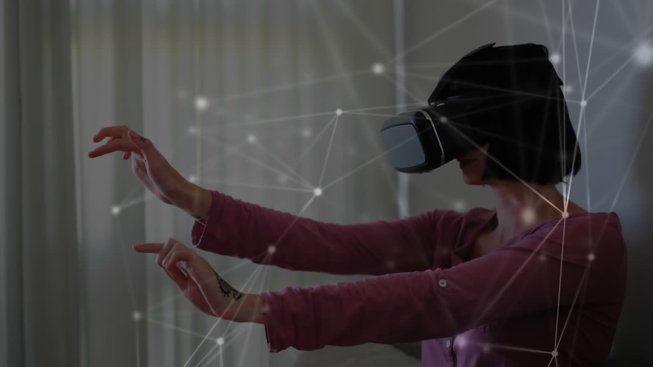 Woman reaching his arms out while wearing a virtual reality headset