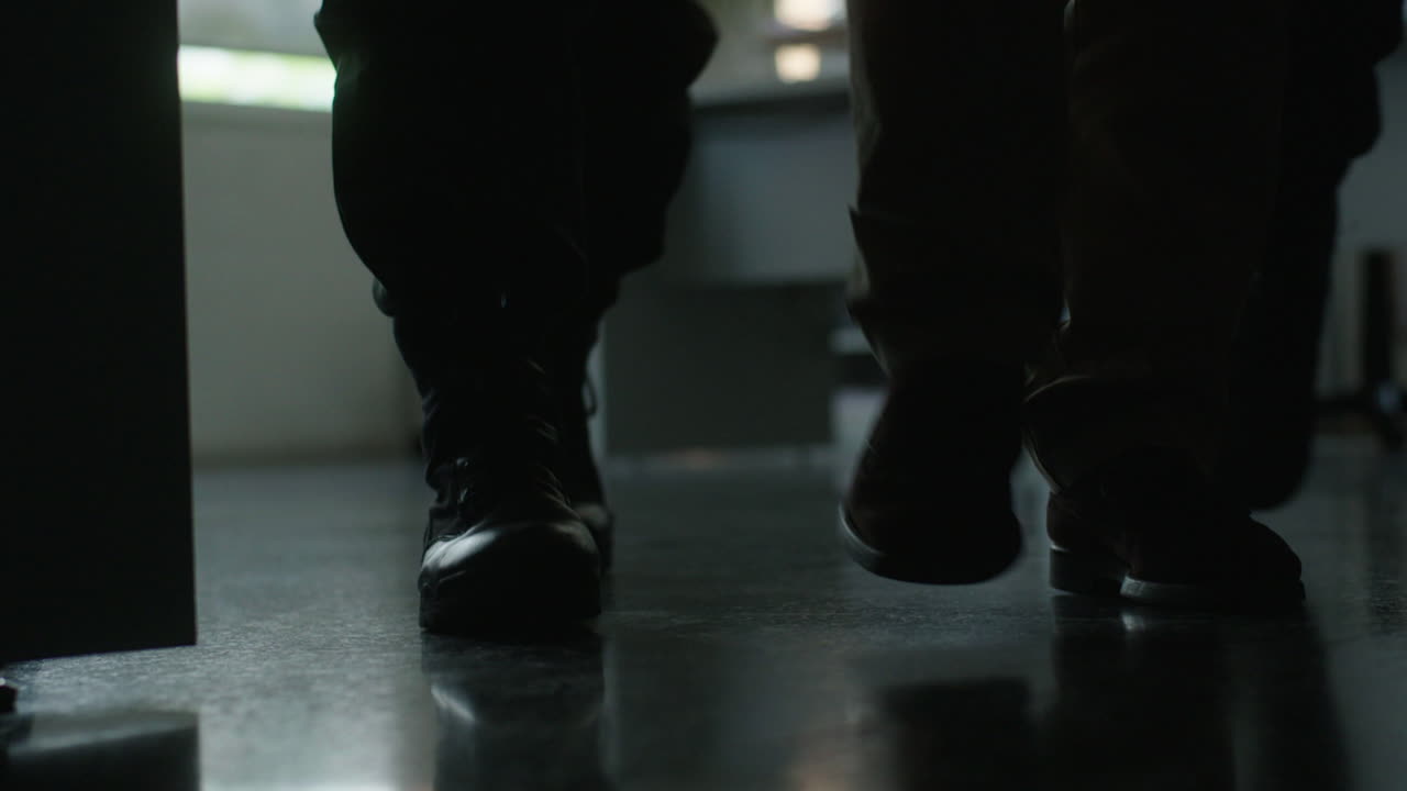 People walking in an office corridor