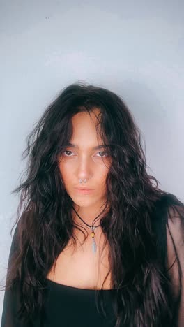 woman portrait with long black hair and nose ring