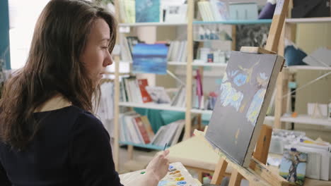 woman painting in an art studio