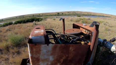 rusty abandoned engine in rural landscape