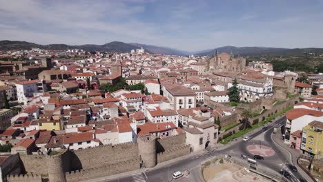 Establishing-aerial-panning-shot-of-historic-town-of-Plasencia-in-Spain,-day