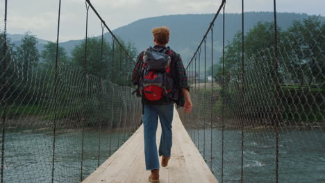 Man-traveling-mountain-nature.-Hiker-walking-enjoying-picturesque-landscape-view