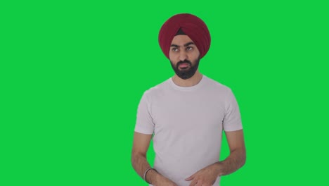 Frustrated-Sikh-Indian-man-flying-a-mosquito-Green-screen