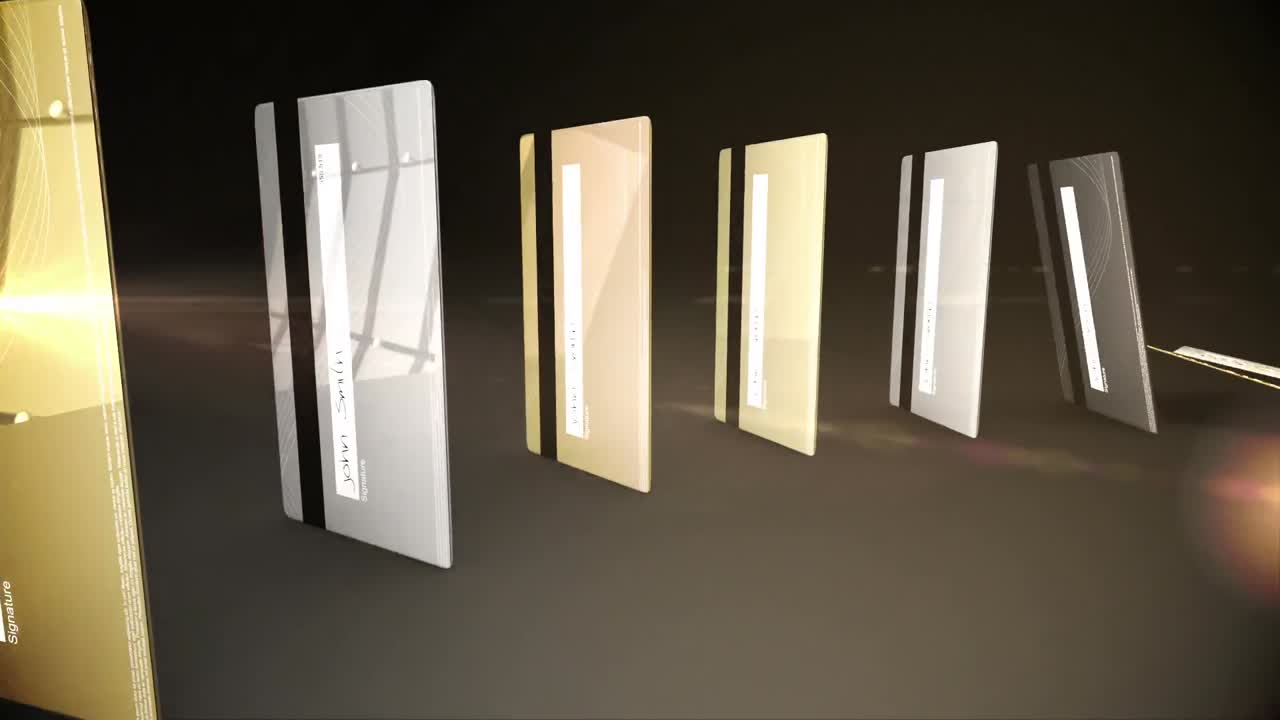 tarjetas de crédito de oro y plata cayendo en un círculo como dominós contra un fondo oscuro