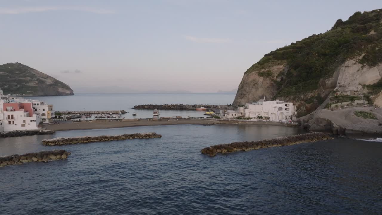Aerial orbit around sand beach in Sant'Angelo on the island Ischia in Italy