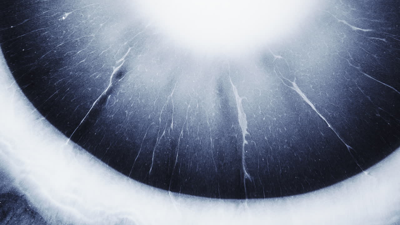 Flowing alcohol ink creates an abstract, mesmerizing macro view, displaying tiny droplets