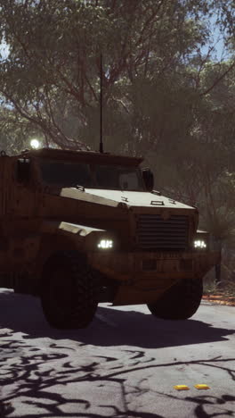 military armored vehicle driving on desert road