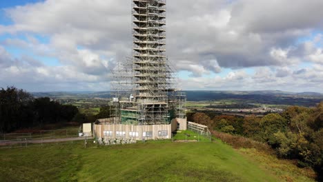 rising view showing the restoration work to the wellington monument in the blackdown hills devon england