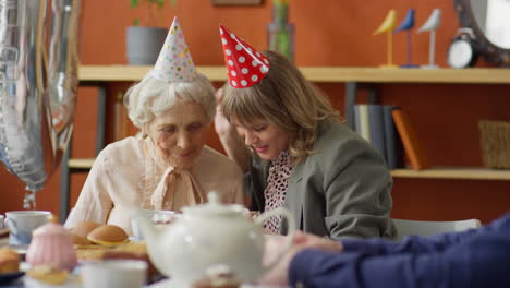 grandmother and granddaughter celebrating birthday with selfie