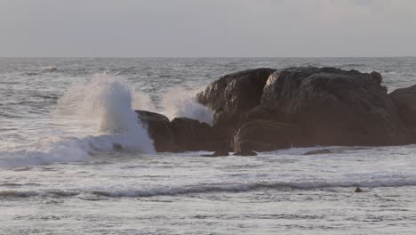 ocean wave crashing on to rocks in evening galle fort seashore slow motion b roll clip