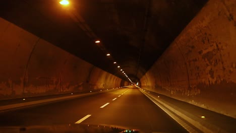 car journey through a tunnel in piedmont, italy