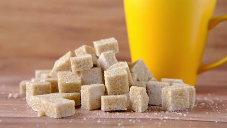 brown sugar cubes with a yellow cup