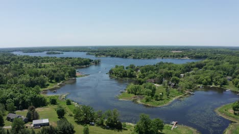 wide reverse pullback shot of north center lake in minnesota