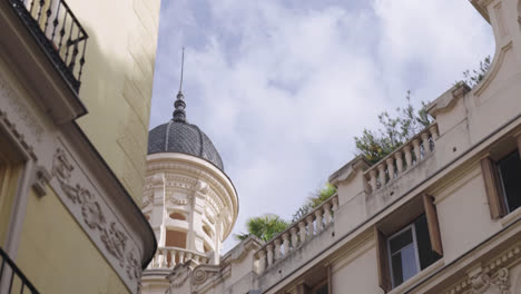 beautiful zoom shot of a central area of   madrid with the dome of a church in daylight on a summer morning.