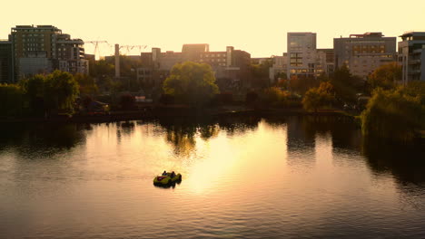 aerial drone shot over cluj-napoca city, iulius mall zone, iulius park, lake view