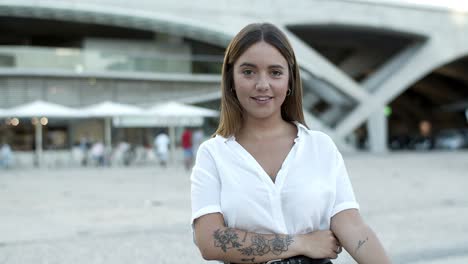 cheerful lady wearing white blouse looking at camera