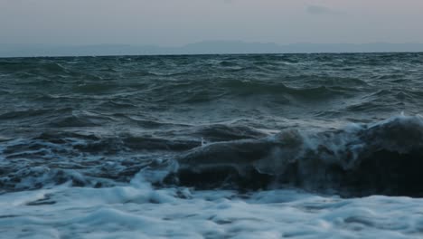 extreme stormy rough sea. sea or ocean, waves close-up view. blue waves sea water. blue crystal clear water. one can see the sandy seabed. sea wave low angle view