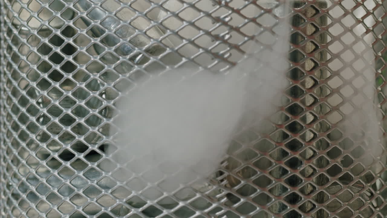 Silver batteries AA and AAA falling into wastebasket close-up. Double-A battery is a standard size single cell cylindrical dry battery. Batteries are common in portable electronic devices. Environmental impacts of lithium-ion batteries concept. An AA battery is composed of a single electrochemical c