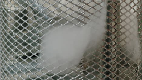 silver batteries aa and aaa falling into wastebasket close-up. double-a battery is a standard size single cell cylindrical dry battery. batteries are common in portable electronic devices. environmental impacts of lithium-ion batteries concept. an aa battery is composed of a single electrochemical c