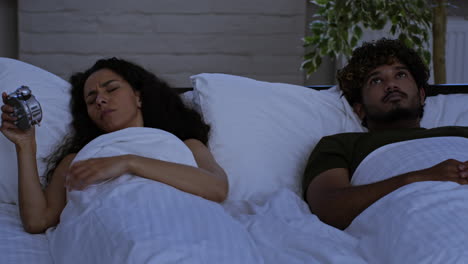 couple in bed with conflict