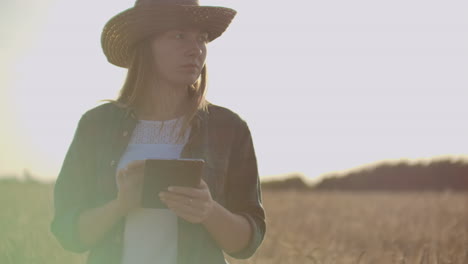 A-woman-farmer-with-tablet.-Smart-farming-and-digital-agriculture.