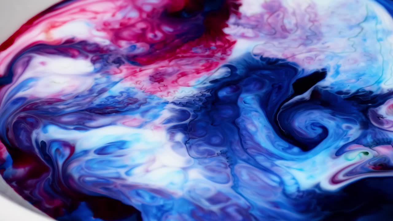 Dynamic red and blue patterns swirl and blend, creating mesmerizing abstract visuals.