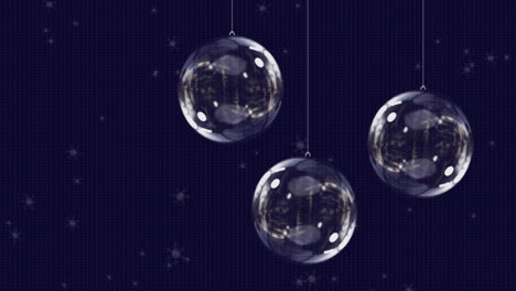 animation of snow falling over glass christmas baubles on black background