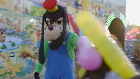 cartoon dog character balloon artist at a carnival